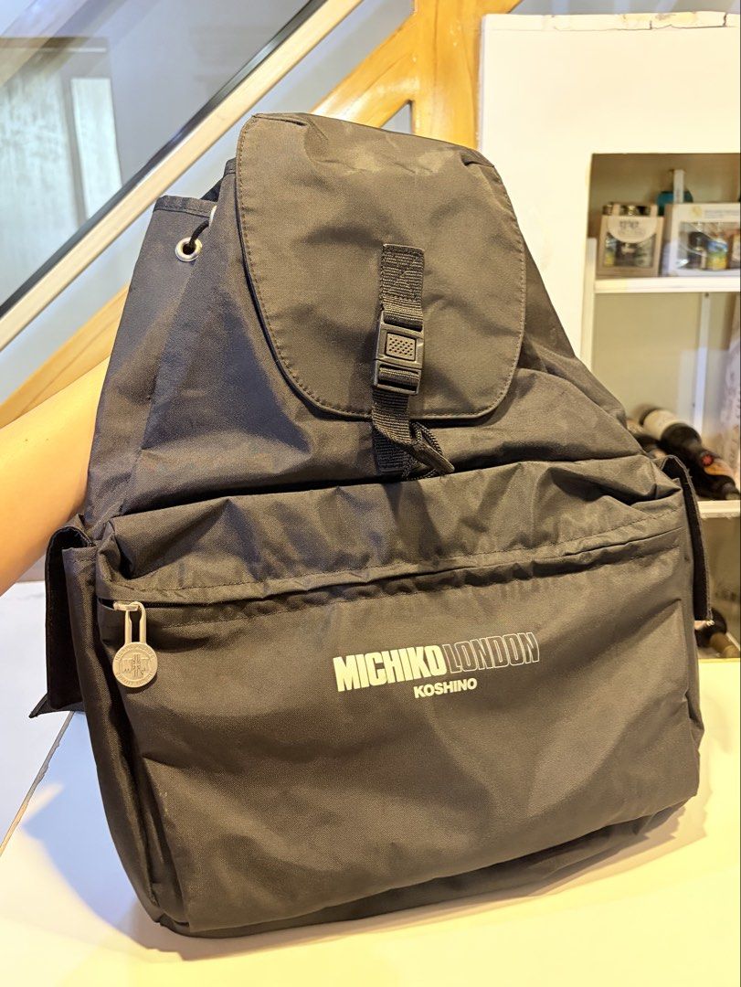Michiko London Black Nylon Backpack (Category: Luxury Bags & Wallets) located in Manila. Submitted by hiraimomos (Listing ID 1469043498, Image 1). Description: bags from japan 🇯🇵 - drawstring closure under the main flap - side pockets with adjustable black shoulder straps - perfect everyday bag for school - no visible flaws - excellent condition (9/10).