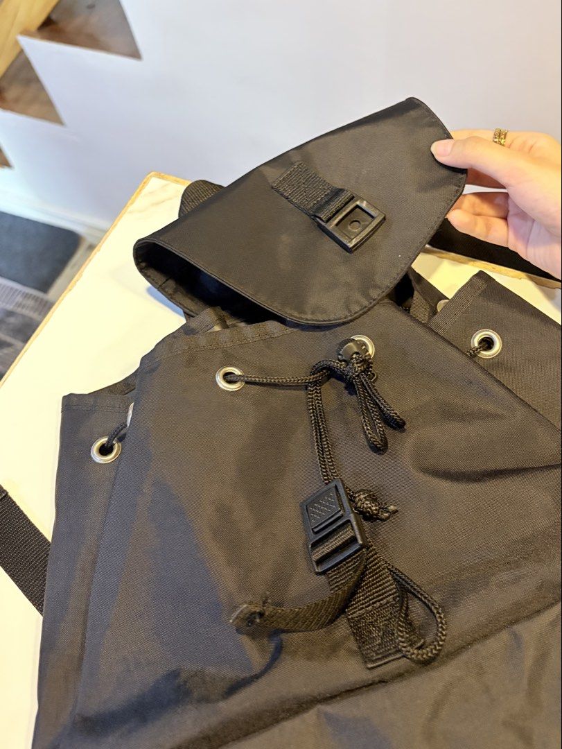 Michiko London Black Nylon Backpack (Category: Luxury Bags & Wallets) located in Manila. Submitted by hiraimomos (Listing ID 1469043498, Image 2). Description: bags from japan 🇯🇵 - drawstring closure under the main flap - side pockets with adjustable black shoulder straps - perfect everyday bag for school - no visible flaws - excellent condition (9/10).