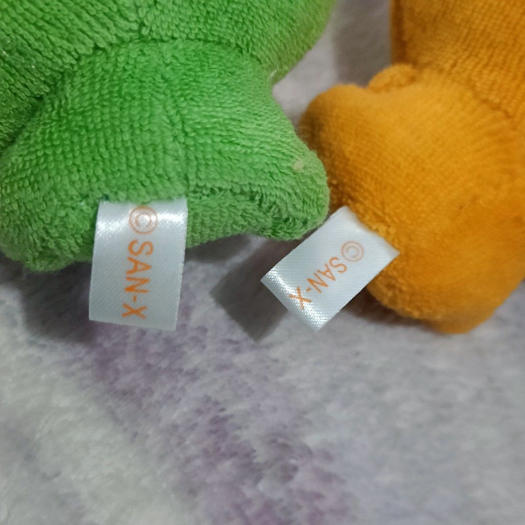 Mikan Bouya San-X plush keychains (Category: Plushies & Soft Toys) located in Baguio. Submitted by baileybails (Listing ID 1468963166, Image 3). Description: - Set of 4 authentic San-X plush keychains - Includes 1 green fruit character and 3 orange characters - Soft and huggable fabric material - Features secure ball chains and original San-X tag labels - Bonus: One orange keychain comes with a red and white tassel charm and a working bell - Clea