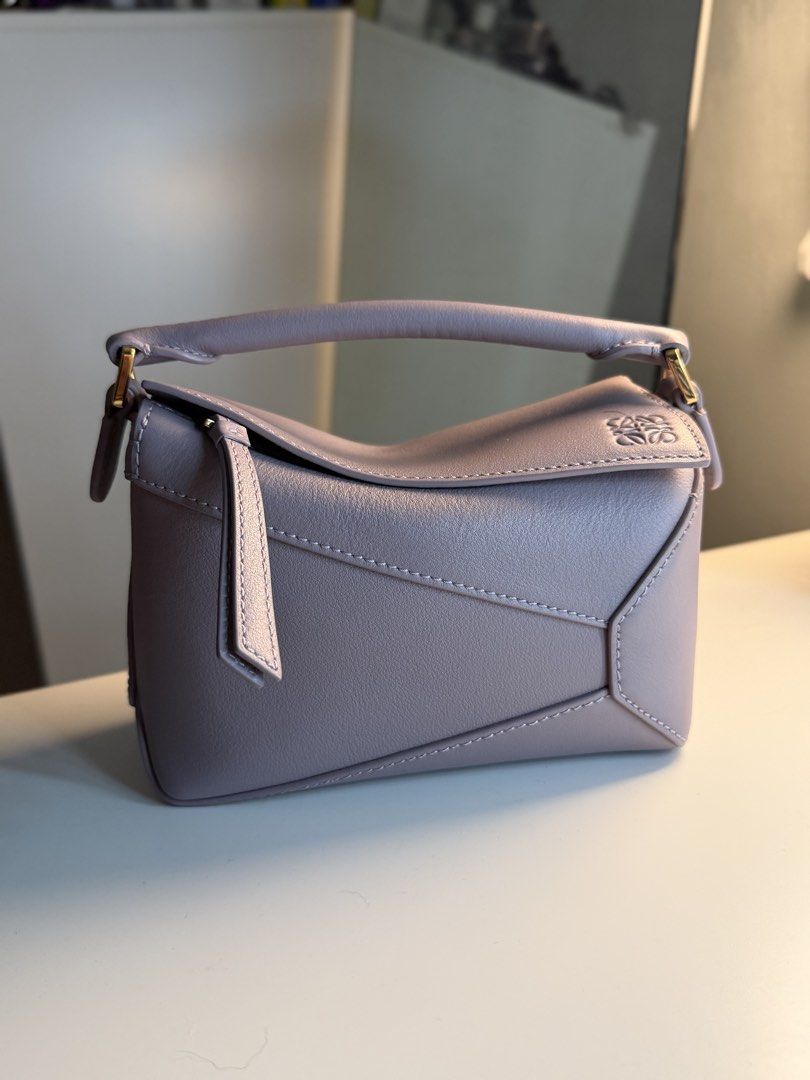 Mini puzzle edge (Category: Cross-body Bags) located in San Pedro. Submitted by happyfindsss (Listing ID 1469067239, Image 1). Description: •mini size •color: lilac 💜 •dm for more details.