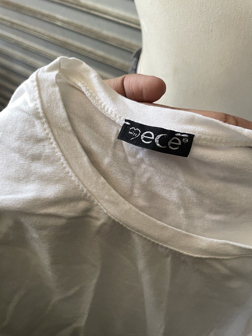 Miss Ece White Long-Sleeve Crew Neck Top (Category: Longsleeves) located in Davao. Submitted by riab_qt (Listing ID 1468946834, Image 2). Description: - Brand: Miss Ece - Color: Solid white - Style: Classic crew neck, long-sleeve top - Fit: Snug, soft, and stretchy fabric - Versatility: Great for layering or daily wear.