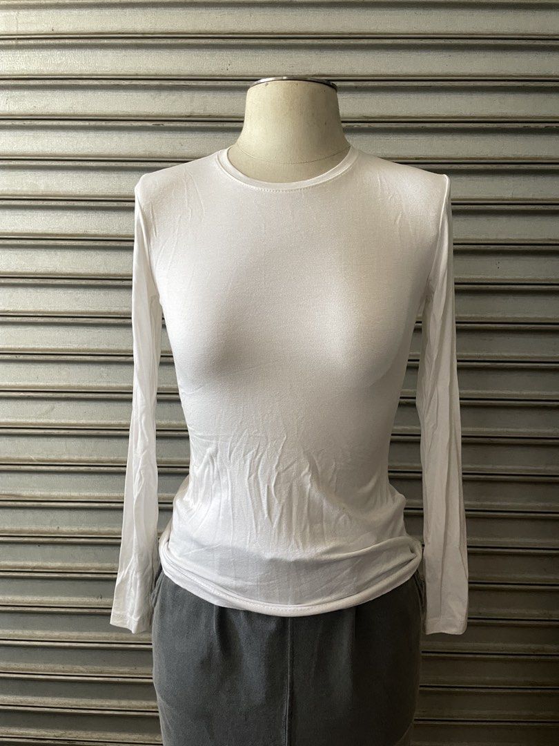 Miss Ece White Long-Sleeve Crew Neck Top (Category: Longsleeves) located in Davao. Submitted by riab_qt (Listing ID 1468946834, Image 1). Description: - Brand: Miss Ece - Color: Solid white - Style: Classic crew neck, long-sleeve top - Fit: Snug, soft, and stretchy fabric - Versatility: Great for layering or daily wear.