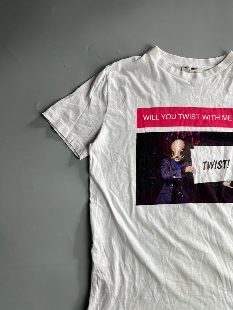 Miu Miu - Twist With Me 2019 Collection - Tee (Category: Luxury Apparel) located in San Pablo. Submitted by hiddenrygn (Listing ID 1468944149, Image 2). Description: Miu Miu - Twist With Me 2019 Collection - Tee Size : M(17” 24”) No flaws Excellent to new condition Authentic DM!.