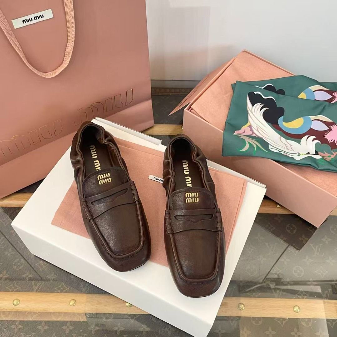 Miu Miu Brown Leather Loafers (Category: Loafers) located in Manila. Submitted by finniehkay13581 (Listing ID 1469005814, Image 3). Description: - Brand: Miu Miu - Item: Rich brown leather slip-on loafers - Details: Gathered elasticized collar, gold logo lettering stamped on the insole - Condition: Brand new, never worn - Inclusions: Branded pink shopping bag, dust bags, and presentation box.