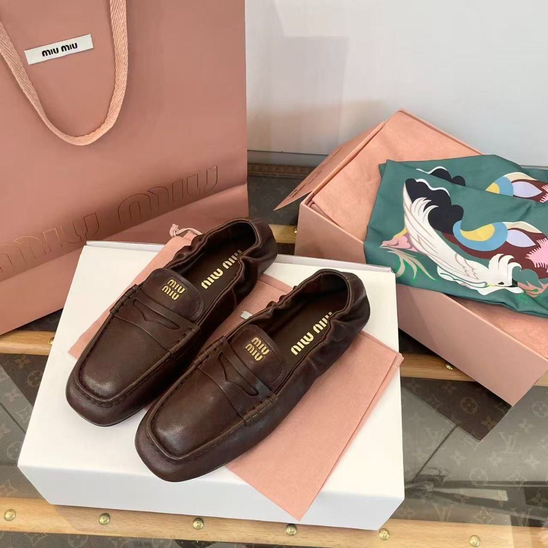 Miu Miu Brown Leather Loafers (Category: Loafers) located in Manila. Submitted by finniehkay13581 (Listing ID 1469005814, Image 1). Description: - Brand: Miu Miu - Item: Rich brown leather slip-on loafers - Details: Gathered elasticized collar, gold logo lettering stamped on the insole - Condition: Brand new, never worn - Inclusions: Branded pink shopping bag, dust bags, and presentation box.