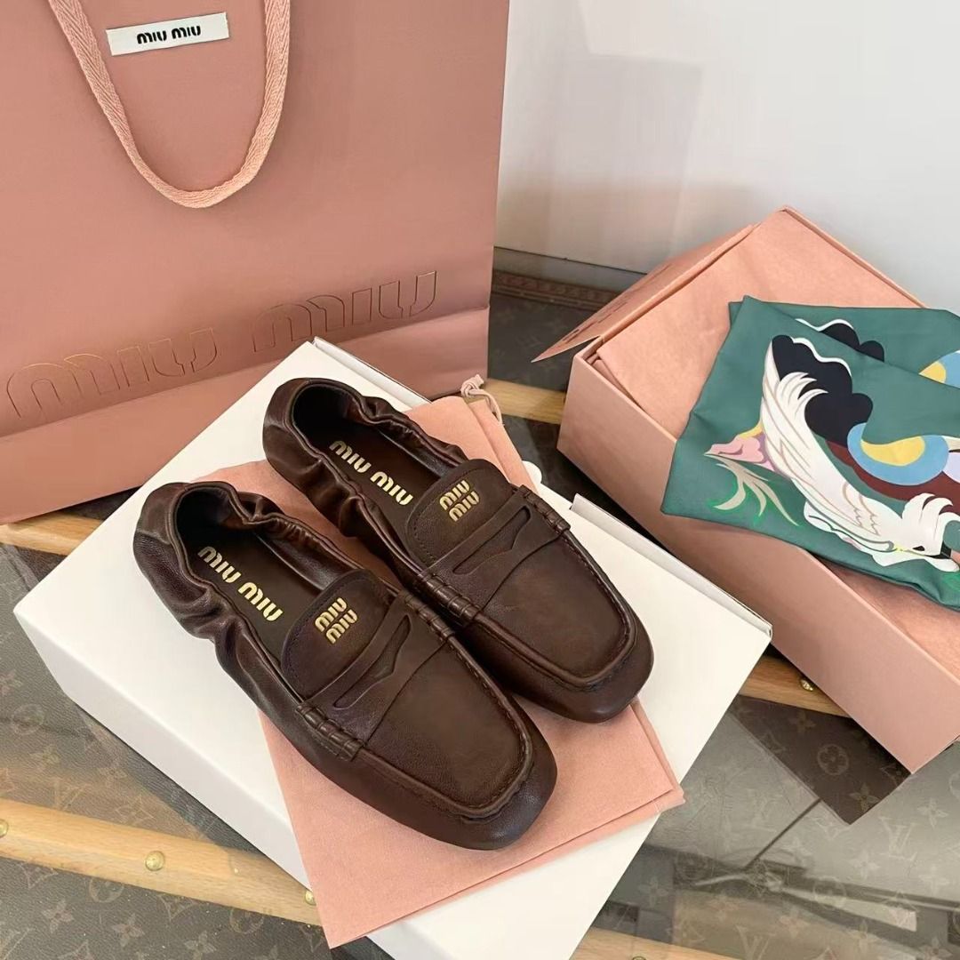 Miu Miu Brown Leather Loafers (Category: Loafers) located in Manila. Submitted by finniehkay13581 (Listing ID 1469005814, Image 2). Description: - Brand: Miu Miu - Item: Rich brown leather slip-on loafers - Details: Gathered elasticized collar, gold logo lettering stamped on the insole - Condition: Brand new, never worn - Inclusions: Branded pink shopping bag, dust bags, and presentation box.