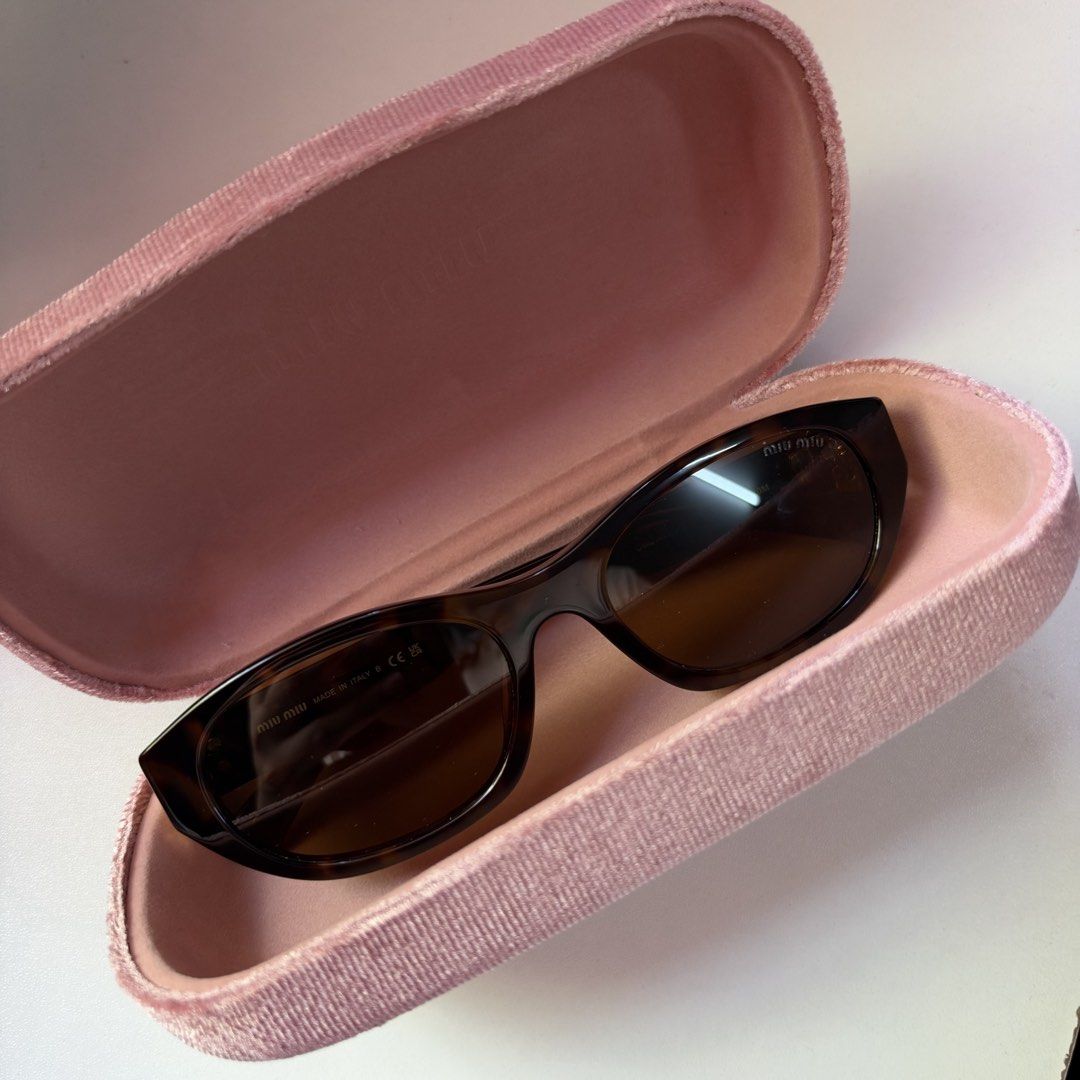 Miu Miu Tortoiseshell Sunglasses (Category: Sunglasses & Eyewear) located in Valenzuela. Submitted by refined.finds (Listing ID 1469135939, Image 3). Description: Please READ including Mailing & Delivery ‼️ Miu Miu tortoiseshell sunglasses Model: A03SF Used only once. In excellent condition. Bought in Hong Kong. Authenticity is not guaranteed. Description: Rectangular frames, brown gradient lenses. Gold-toned metal branding stacked along the temp