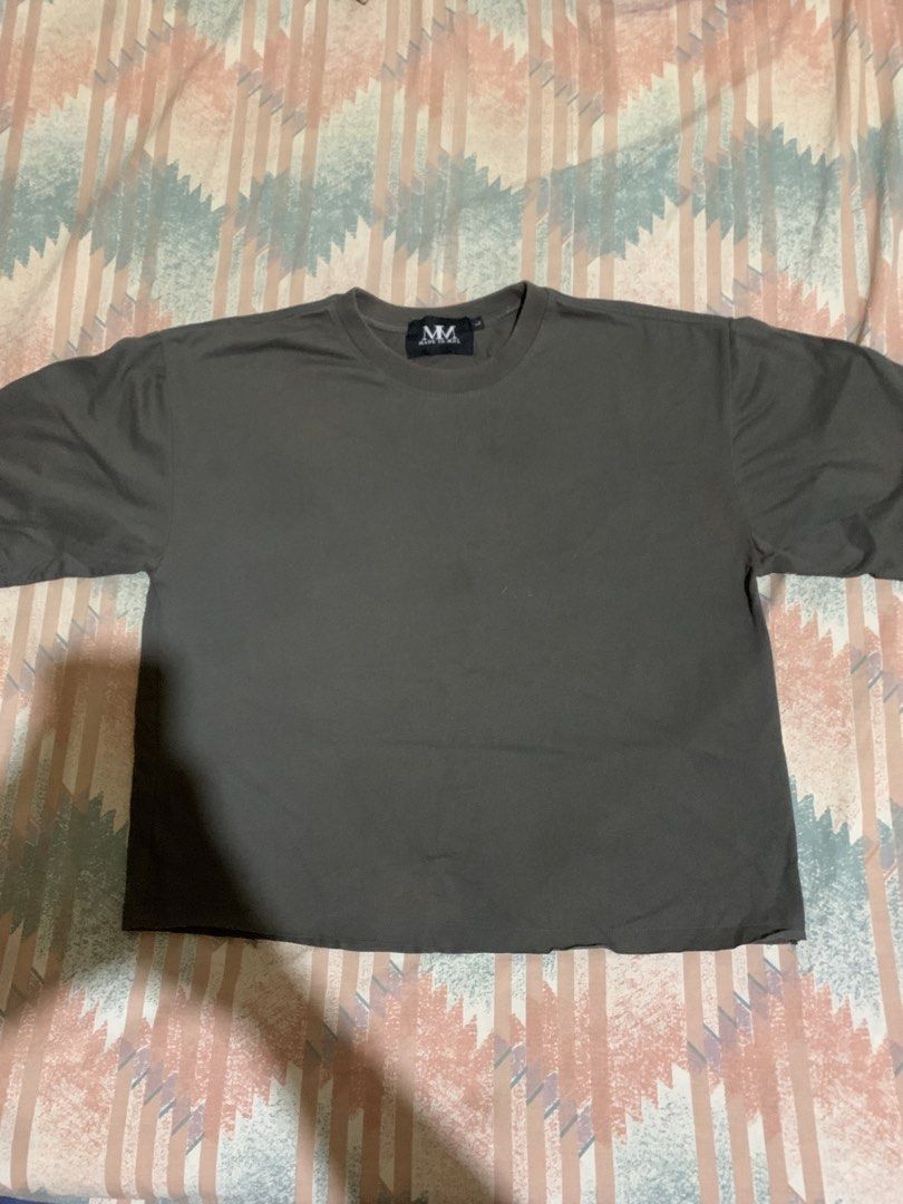 M.M. Oversized T-Shirt (Category: Shirts) located in Manila. Submitted by trickfinds (Listing ID 1468972368, Image 1). Description: - Brand/Model: M.M. dark grey t-shirt - Fit & Style: Boxy fit with relaxed drop shoulder sleeves and raw hem - Details: Crew neck collar with branded black neck tag - Material: Heavyweight cotton for a structured look - Condition: Clean overall, great everyday basic that goes with everything.