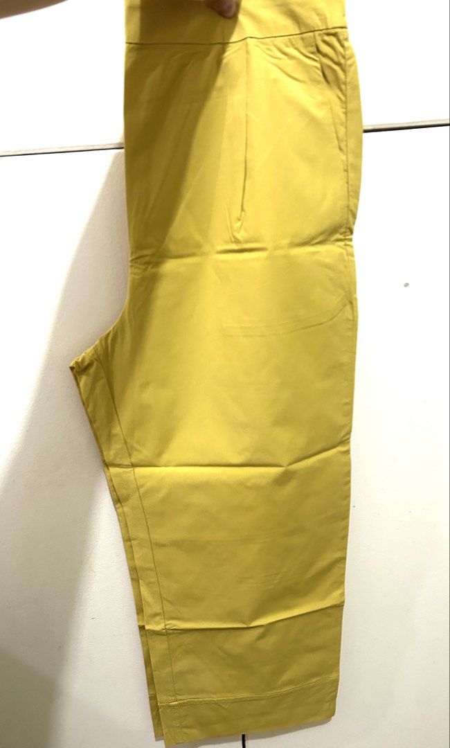 MNG Yellow Casual Pants Size M (Category: Jeans) located in Manila. Submitted by ab.mendoza (Listing ID 1468978436, Image 1). Description: - Brand: MNG - Size: M - Color: Bright yellow - Fit: Easy pull-on style with elastic waistband - Design: Structured fabric that holds shape well with a straight-leg cut hitting at the ankle - Condition: Excellent for adding a fun pop of color to daily outfits.