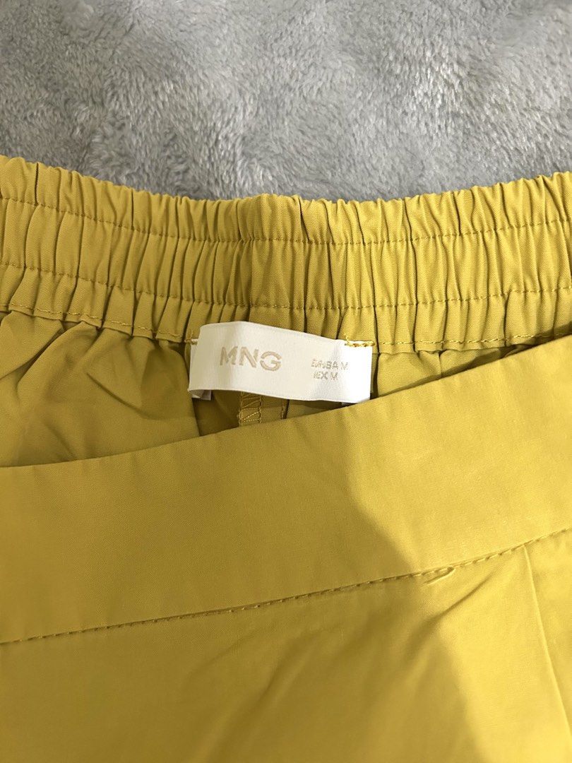 MNG Yellow Casual Pants Size M (Category: Jeans) located in Manila. Submitted by ab.mendoza (Listing ID 1468978436, Image 2). Description: - Brand: MNG - Size: M - Color: Bright yellow - Fit: Easy pull-on style with elastic waistband - Design: Structured fabric that holds shape well with a straight-leg cut hitting at the ankle - Condition: Excellent for adding a fun pop of color to daily outfits.