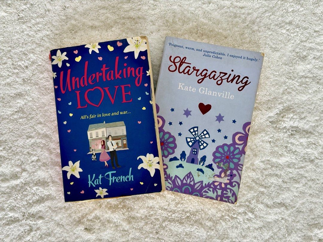 Modern Chick-Lit Book Bundle of 2 (Category: Storybooks) located in Naga. Submitted by klutzdeclutters (Listing ID 1468942936, Image 1). Description: Includes: - Undertaking Love by Kat French - Stargazing by Kate Glanville Condition: - Covers show noticeable edge wear and light scuffing along the corners, particularly visible on the spine edges, with minor creasing from reading. • Pages display slight handling wear and standard page-edge tanning