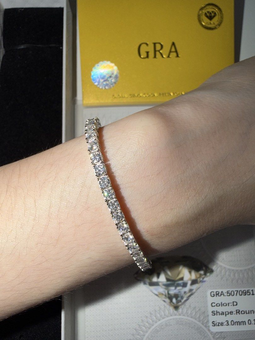Moissanite Tennis Bracelet GRA (Category: Bracelets) located in Taytay. Submitted by kayecincoda (Listing ID 1468180450, Image 3). Description: Moissanite Tennis Bracelet - Size: 15cm length, 3mm thick, 0.3ct - Color Grade: D (highest colorless grade for brilliant sparkle) - Setting: Pure silver plated in platinum - Inclusions: GRA certificate included as shown - Condition: Brand new and super sparkly under the light.