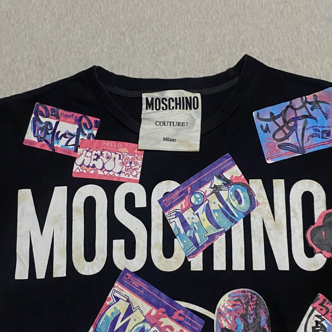 Moschino (Category: Shirts) located in Mabalacat. Submitted by stellargarments (Listing ID 1468974511, Image 3). Description: Length : 25 Width : 17 Condition : 9/10 buo pa mga logos complete taga smooth pa tela medjo lukot pa po check prints po need wash fresh from bale color may vary due to lighting.