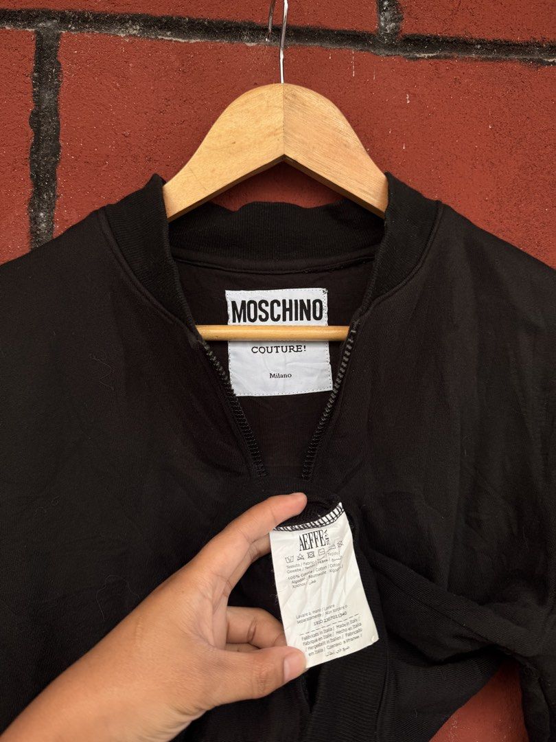 Moschino (Category: Coats, Jackets and Outerwear) located in Baguio. Submitted by mardimercredi14 (Listing ID 1469045642, Image 3). Description: 🔥 Moschino Dimensions: 23*23 Condition: excellent Color Rate: 10 ❌ none.