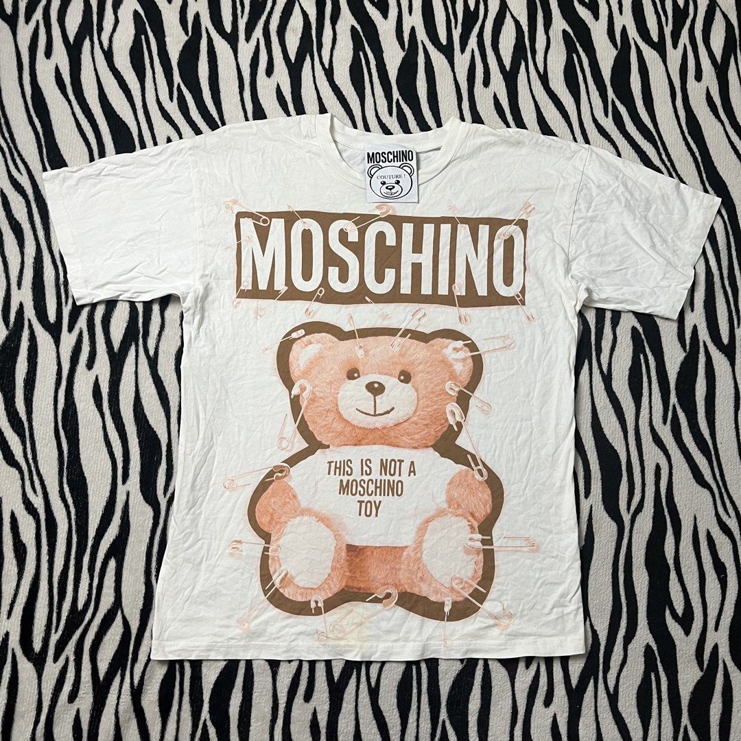 Moschino bear tshirt (Category: Shirts) located in Manila. Submitted by royaldripmanila (Listing ID 1469082429, Image 1). Description: Need wash only W19 L26.