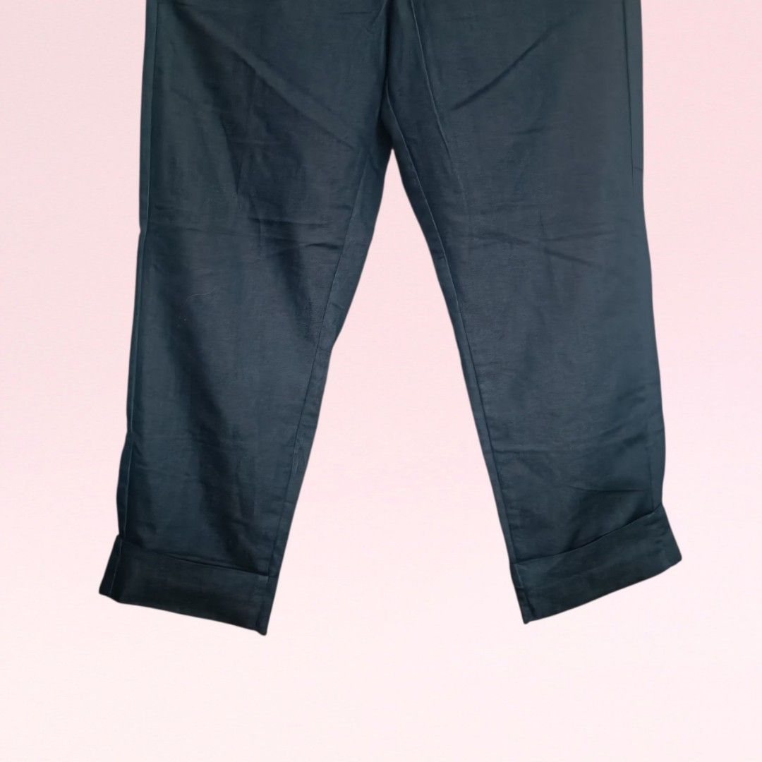 Mossimo Ankle Trousers (Category: Other Bottoms) located in Quezon City. Submitted by firstlovedbyb (Listing ID 1468959863, Image 3). Description: Authentic Mossimo ankle trousers. With 2 side pocket and belt loops. With fixed hem fold. Actual color is midnight blue/black (color in photo may vary due to lighting and phone cam quality). No major flaws or issues. Good as new. Size on tag: 10 Waist: 32 inches Length: 34 inches.