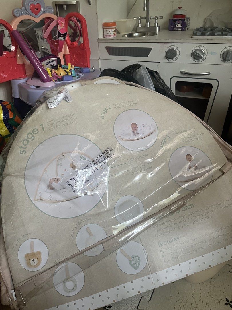 Mothercare Playgym (Category: Infant Playtime) located in Las Pinas. Submitted by freeowl_eb0f7b (Listing ID 1468936939, Image 2). Description: - Brand: Mothercare - Condition: Clean and well-maintained - Design: Soft padded circular base with a cute polka dot pattern - Features: Overhead arches for entertainment during resting or tummy time - Toys included: Plush hanging elephant and colorful rattling ball - Benefit: Safe and comfortable spot fo