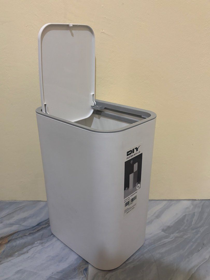 mr.diy Dustbin with Lid 8L White (Category: Waste Bins & Bags) located in Baguio. Submitted by amaraciel (Listing ID 1468976915, Image 2). Description: - Brand: MR.DIY - Capacity: 8L - Color: Clean white body with a grey rim - Mechanism: Smooth flip-up lid - Design: Compact rectangular shape for tight spaces - Ideal for: Bedroom, bathroom, or office desk - Condition: Excellent, clean with original product sticker (TG5200/8978667) still attached.
