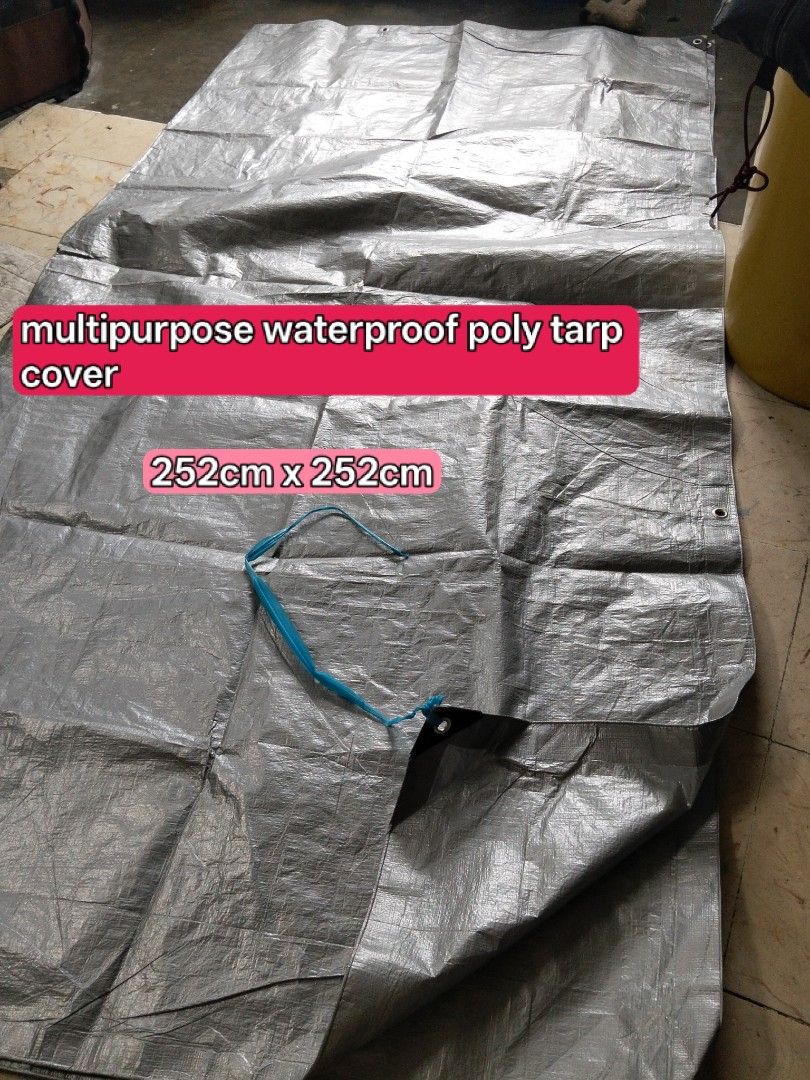 Multipurpose Silver Tarp and Coffee Sun Shade Mesh (Category: Outdoor Furniture) located in Abucay. Submitted by cristineca20489 (Listing ID 1469148650, Image 1). Description: - Silver waterproof poly tarp (252cm x 252cm) with minor tear that is easily patched with tape - Brown sun shade mesh (196cm x 237cm) ideal for privacy and sun protection - Both items equipped with durable metal grommets around the edges - Versatile multi-use covers perfect