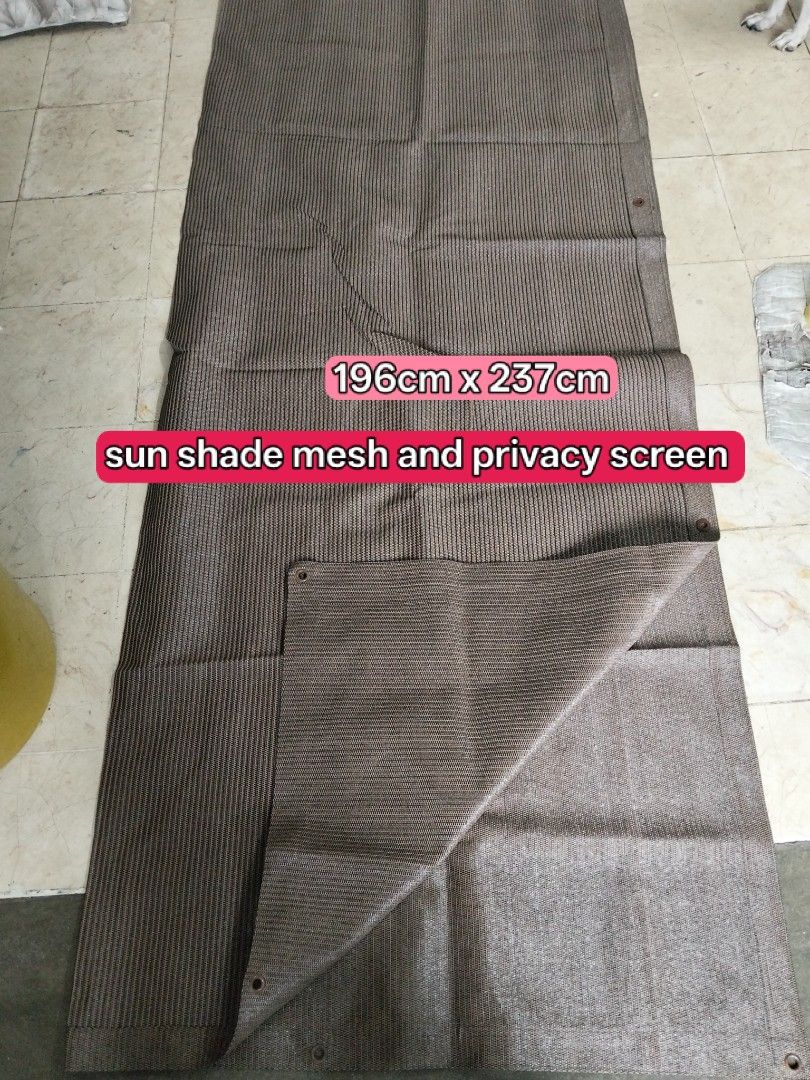 Multipurpose Silver Tarp and Coffee Sun Shade Mesh (Category: Outdoor Furniture) located in Abucay. Submitted by cristineca20489 (Listing ID 1469148650, Image 2). Description: - Silver waterproof poly tarp (252cm x 252cm) with minor tear that is easily patched with tape - Brown sun shade mesh (196cm x 237cm) ideal for privacy and sun protection - Both items equipped with durable metal grommets around the edges - Versatile multi-use covers perfect