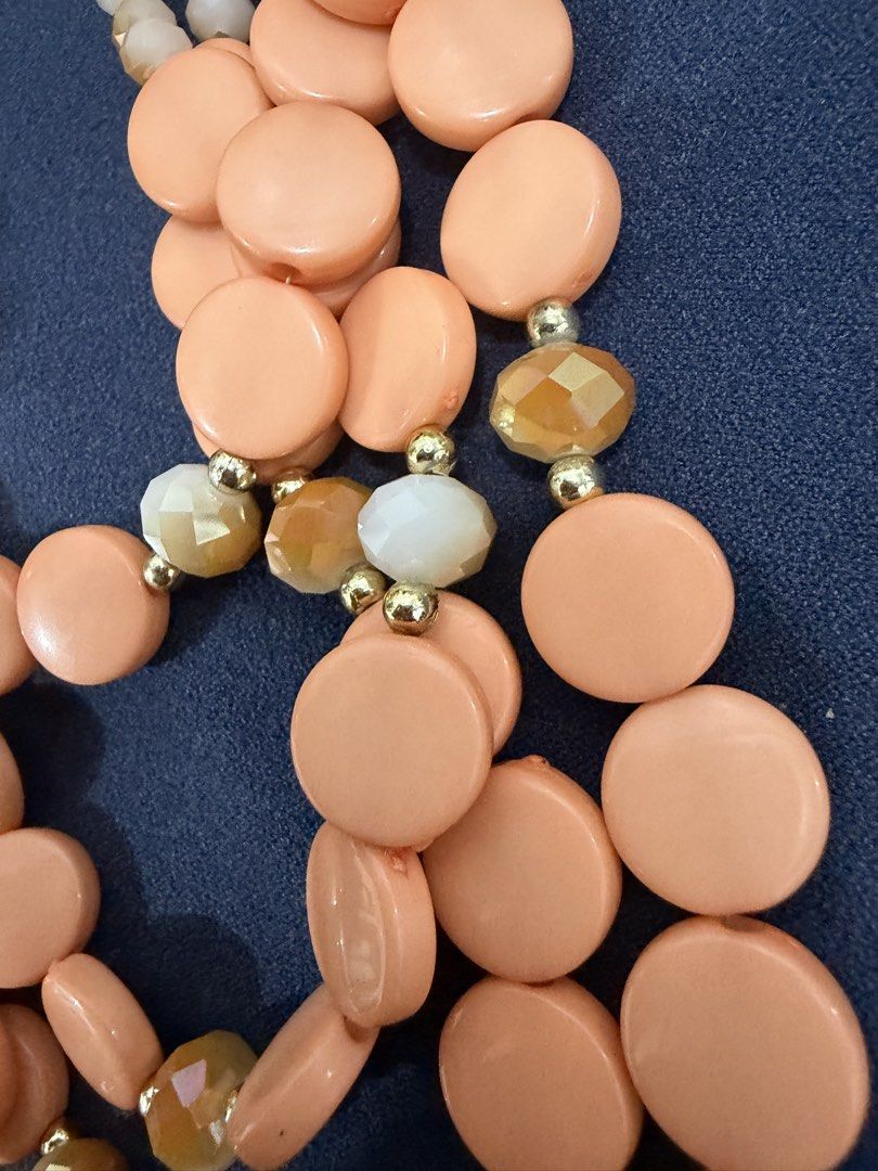 Multi-strand peach statement necklace with gold chain (Category: Necklaces) located in Makati City. Submitted by petite_preloved2 (Listing ID 1469056532, Image 3). Description: - Style: Multi-strand statement necklace in gorgeous peach tones - Details: Features round beads, cylindrical beads, sparkly faceted crystals, and gold-tone spacers - Design: Upper section features a trendy chunky gold chain link with a secure closure.