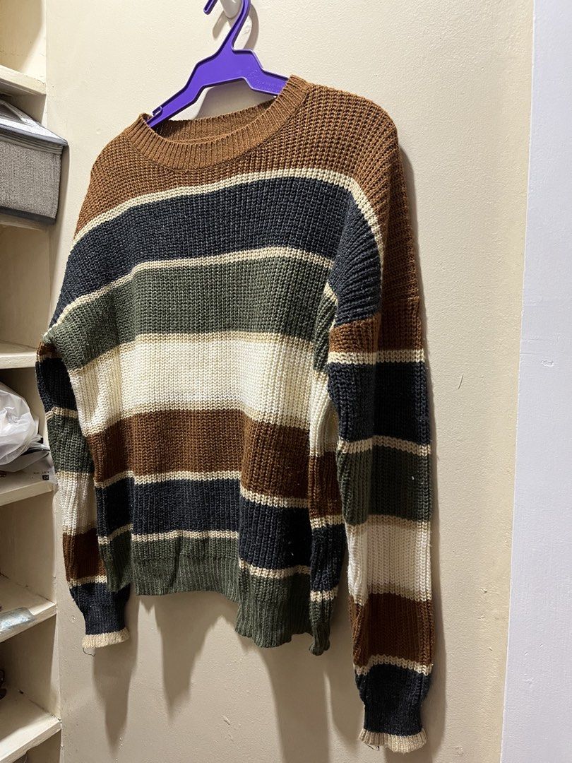 Multi-stripe chunky knit sweater in earth tones (Category: Coats, Jackets and Outerwear) located in Paranaque City. Submitted by saxii (Listing ID 1468969572, Image 1). Description: small to large - Style: Cozy chunky knit sweater with a relaxed fit - Design: Wide horizontal stripes in brown, dark grey, olive green, and cream - Details: Classic crew neck, ribbed cuffs, and hem - Versatility: Warm, earthy tones that pair easily with jeans or skirt