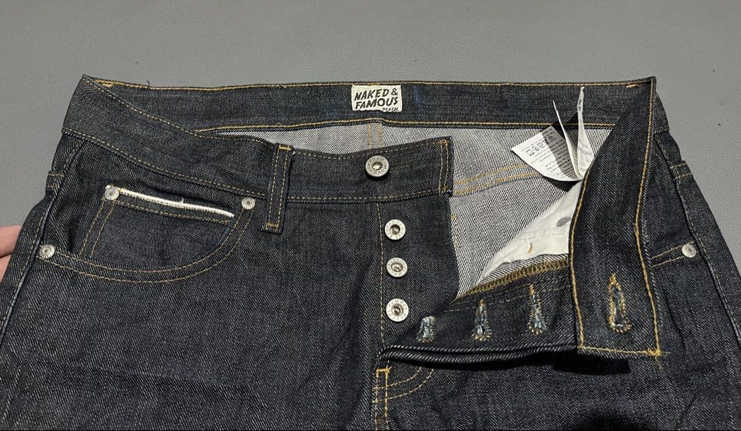 Naked & Famous Denim Jeans (Category: Jeans) located in General Santos City (Dadiangas). Submitted by thiftnibadi3 (Listing ID 1469045267, Image 3). Description: - Brand: Naked & Famous - Material: Premium Japanese raw selvedge denim in dark indigo - Details: Classic button fly, branded hardware, and selvedge ID inside the coin pocket - Patch: Thick leather back patch with signature comic book girl graphic - Condition: Clean dark wash with rigid 