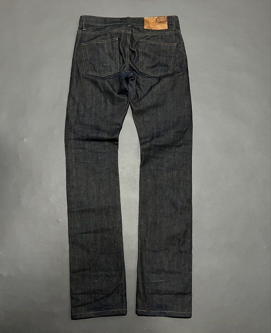 Naked & Famous Denim Jeans (Category: Jeans) located in General Santos City (Dadiangas). Submitted by thiftnibadi3 (Listing ID 1469045267, Image 2). Description: - Brand: Naked & Famous - Material: Premium Japanese raw selvedge denim in dark indigo - Details: Classic button fly, branded hardware, and selvedge ID inside the coin pocket - Patch: Thick leather back patch with signature comic book girl graphic - Condition: Clean dark wash with rigid 