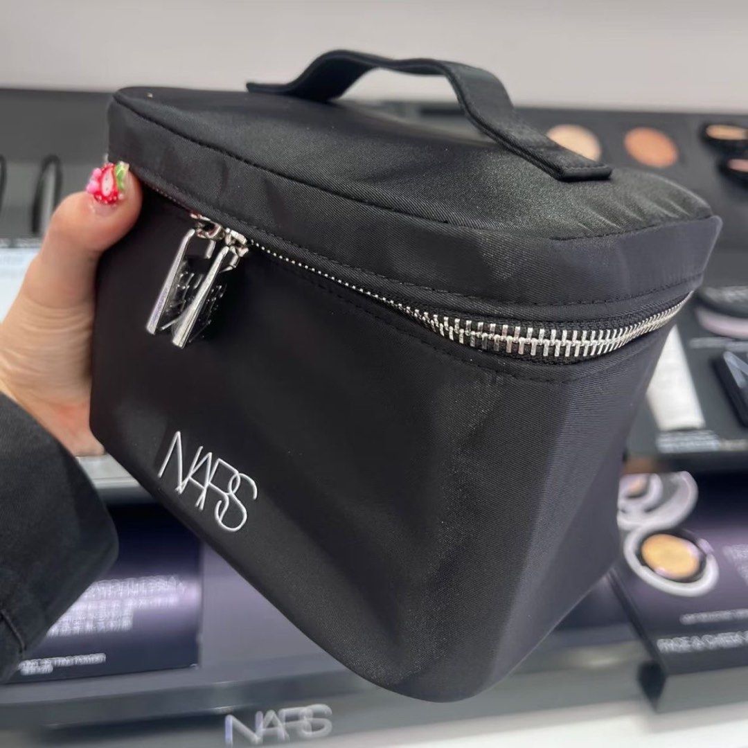 NARS Black Vanity Makeup Case Travel Pouch (Category: Purses & Pouches) located in Taguig. Submitted by mengxir20193848 (Listing ID 1469076948, Image 2). Description: - Brand: NARS - Color: Classic black with white logo and silver hardware - Design: Sturdy structured shape with a convenient top handle and wide-opening zipper - Storage: Roomy main compartment that easily fits travel bottles, plus an interior slip pocket - Condition: Brand new / Ex