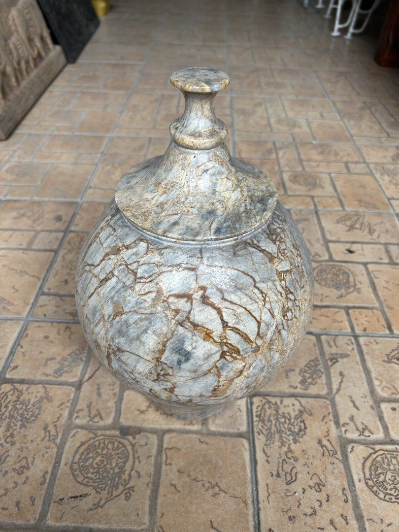 Solid Natural Marble Stone Storage Jar with Lid (Category: Vases & Decorative Bowls) located in Manila. Submitted by jonalyn36017 (Listing ID 1468970693, Image 2). Description: - Material: Solid 100% natural marble with a smooth, polished surface (Heavy) - Design: Elegant round container featuring unique grey and brown veining - Lid: Matching lid included with a beautifully carved handle knob - Weight: Heavyweight, premium quality piece - Use: Pe