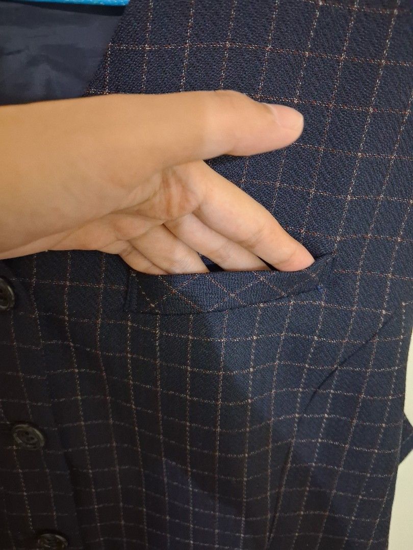 navy blue plaid formal vest with functional pockets (Category: Sleeveless) located in Calabanga. Submitted by asmallcloset (Listing ID 1468958340, Image 3). Description: Navy blue dress vest by Lemony. Subtle plaid pattern with thin reddish-brown and white grid lines. Dark inner lining. Four front buttons and two lower front pockets. Clean structured fabric, great for smart casual wear or formal events..