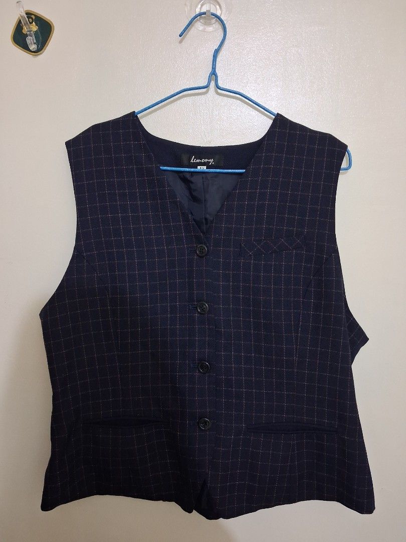 navy blue plaid formal vest with functional pockets (Category: Sleeveless) located in Calabanga. Submitted by asmallcloset (Listing ID 1468958340, Image 1). Description: Navy blue dress vest by Lemony. Subtle plaid pattern with thin reddish-brown and white grid lines. Dark inner lining. Four front buttons and two lower front pockets. Clean structured fabric, great for smart casual wear or formal events..