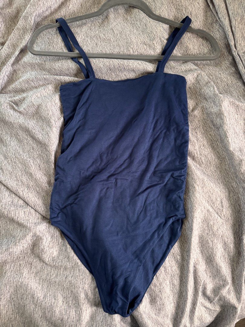 Navy Blue Sleeveless Bodysuit (Category: Sleeveless) located in Quezon City. Submitted by ianne.declutter (Listing ID 1469002887, Image 2). Description: used max 2 times - Color: Navy blue - Design: Square neckline with thin double straps - Material: Soft and stretchy fabric - Features: Convenient bottom snaps, great for layering or on its own - Condition: Excellent, clean with no stains or damage.
