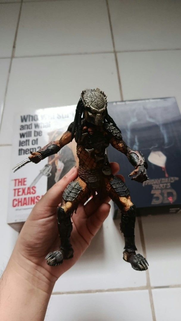 NECA Wolf Predator (Category: Figurines & Statues) located in Las Pinas. Submitted by kevinalegre1897 (Listing ID 1469128190, Image 1). Description: ITEM IS AS IS WHAT YOU SEE IS WHAT YOU GET‼️ - Height: Stands approx. 7 inches tall - Features: Detailed armor, painted skin, and gear - Weapons: Retractable wrist blades on the right arm - Articulation: Fully articulated joints for dynamic posing - Ideal for: Movie memorabilia collectors and horror 