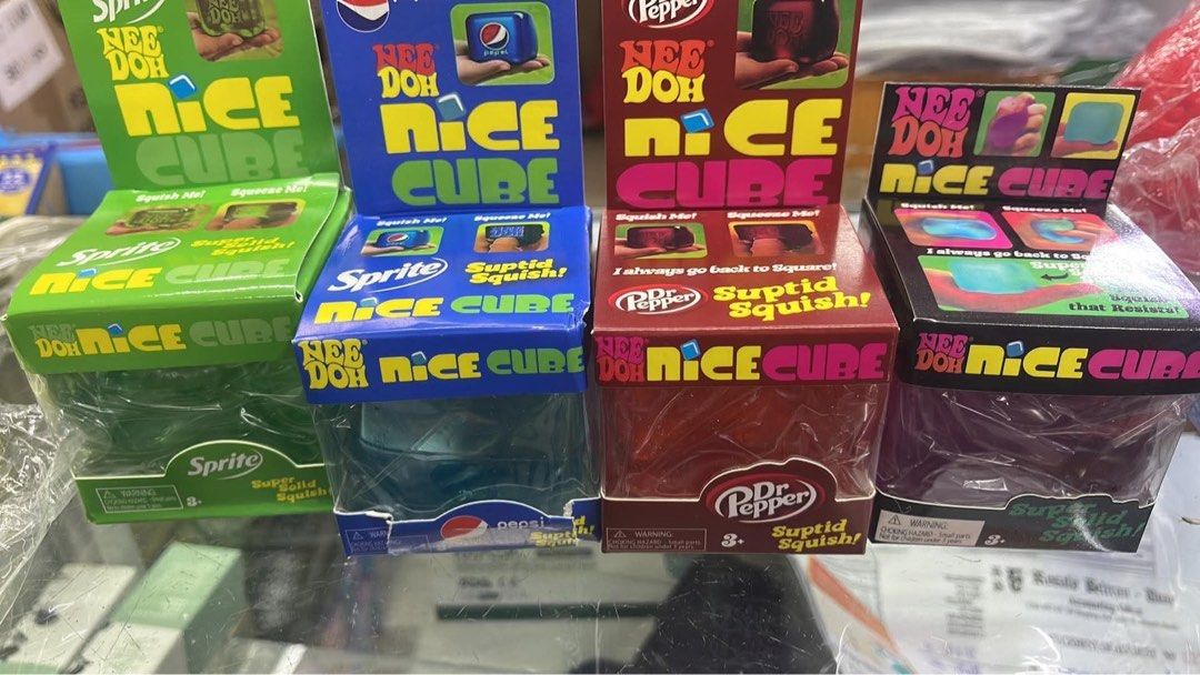 NeeDoh Nice Cube & Nice Can Fidget Toys (Category: Kids Toys) located in Valenzuela. Submitted by new_needoh (Listing ID 1469015644, Image 1). Description: - Collection of NeeDoh sensory squish toys - Includes Nice Cube and Nice Can versions with iconic soda brands (Sprite, Pepsi, Dr Pepper, Fanta, Coca-Cola) - Super solid squish style, perfect for stress relief or display - Brand new, unopened, and in pristine condition - Perfect gift or additio