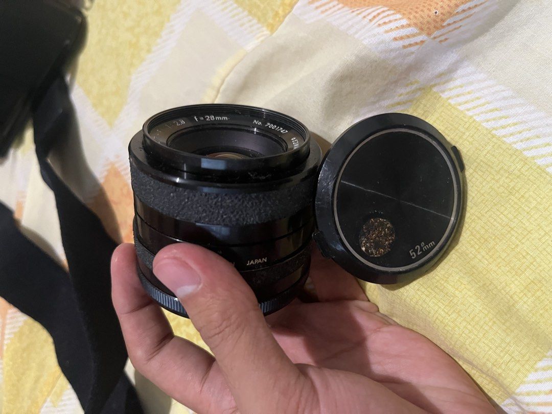 NEGOTIABLE! Tamron Vintage Camera Lens (Category: Lens & Kits) located in Rodriguez. Submitted by nolascokurt (Listing ID 1469116535, Image 2). Description: - Brand: Tamron Vintage Camera Lens - Specifications: f=28mm, 1:2.8, 52mm filter size - Origin: Made in Japan - Inclusions: Comes with original lens cap - Condition: Good vintage condition with classic aesthetic - Meet-up Locations: Gateway Mall, U.P. Town Center, or Farmers Market (Cubao).