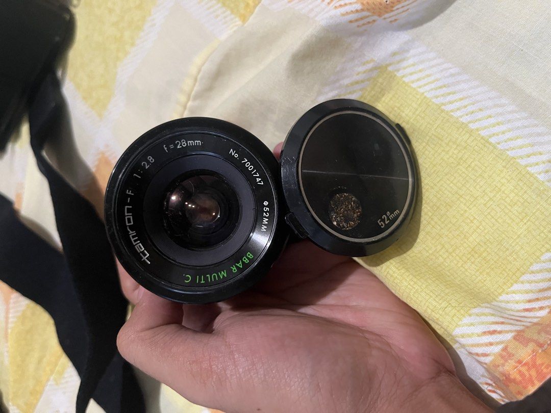 NEGOTIABLE! Tamron Vintage Camera Lens (Category: Lens & Kits) located in Rodriguez. Submitted by nolascokurt (Listing ID 1469116535, Image 1). Description: - Brand: Tamron Vintage Camera Lens - Specifications: f=28mm, 1:2.8, 52mm filter size - Origin: Made in Japan - Inclusions: Comes with original lens cap - Condition: Good vintage condition with classic aesthetic - Meet-up Locations: Gateway Mall, U.P. Town Center, or Farmers Market (Cubao).