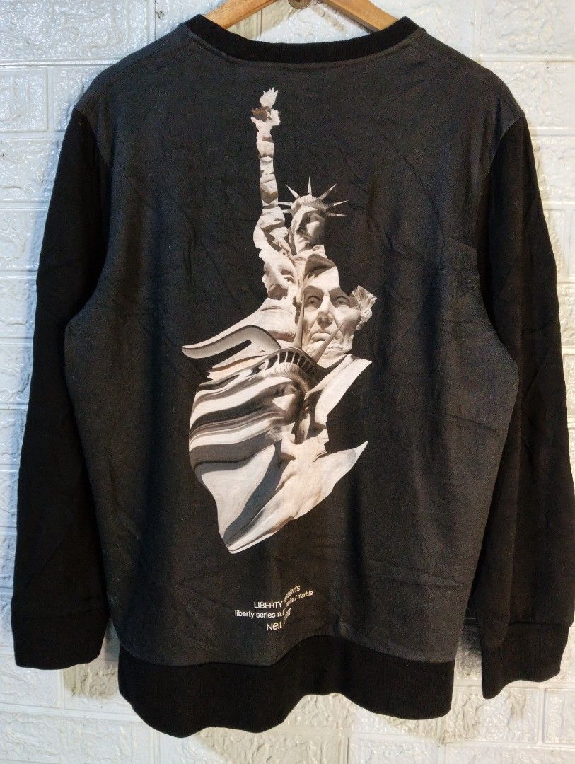 Neil Barrett Liberty Series Sweatshirt (Category: Coats, Jackets and Outerwear) located in Davao. Submitted by noelamihan05424 (Listing ID 1468931019, Image 2). Description: - Brand: Neil Barrett (Liberty Series) - Color: Dark grey body with solid black sleeves and trim - Design: Large graphic print of the Statue of Liberty and Abraham Lincoln on front and back - Features: Functional side zippers at the lower hem, round neckline - Fit: Straight s