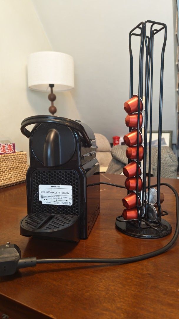 Nespresso Machine with Capsule Holder (Category: Coffee Machines & Makers) located in Mandaluyong City. Submitted by baggaholic_ (Listing ID 1469015064, Image 1). Description: - Color: Sleek black, compact design ideal for small kitchens - Features: Removable water tank at the back, standard plug - Bonus: Includes a revolving wire coffee pod tower stocked with capsules ‼️ - Condition: Works great, makes quick morning espressos Reason for selling:
