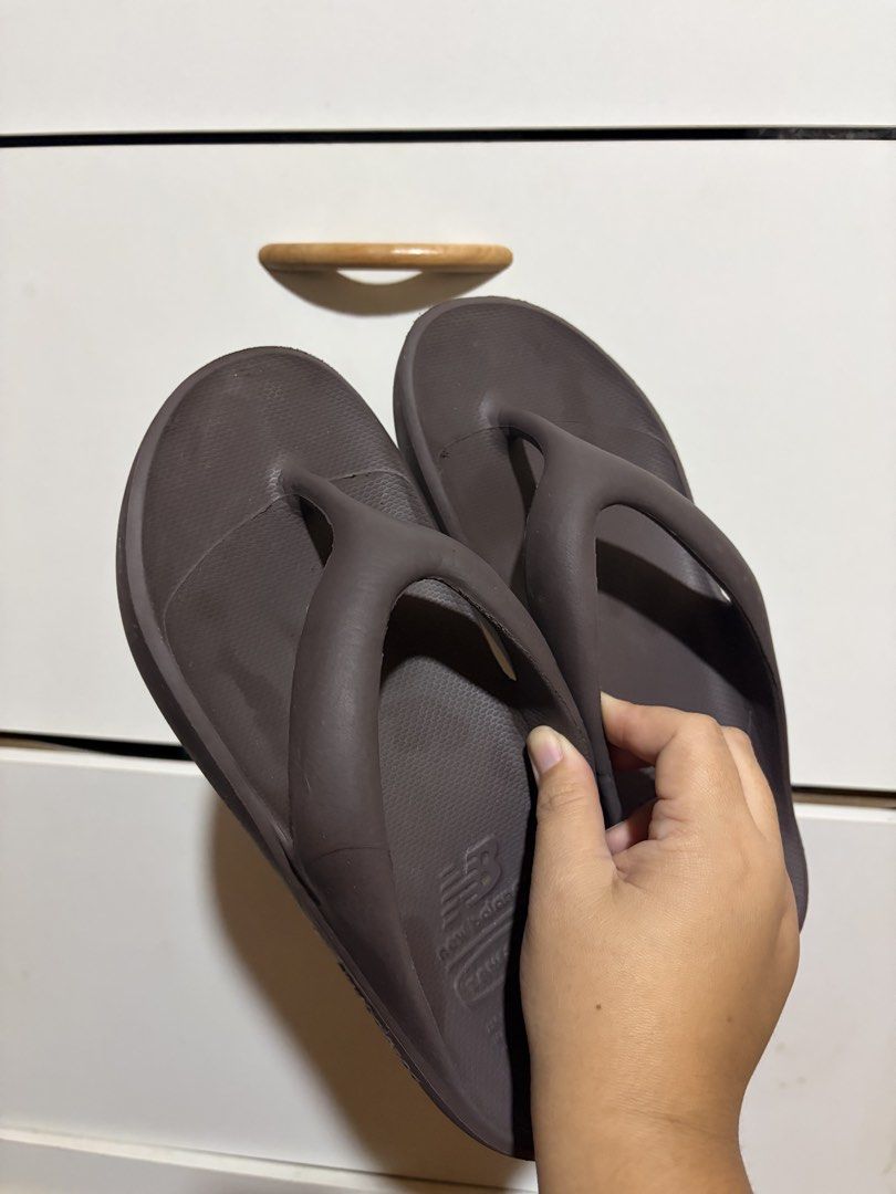 New Balance x TAW & TOE Zeroity Flip Flops Brown (Category: Slippers & Slides) located in Siquijor. Submitted by yhostuff (Listing ID 1469012079, Image 1). Description: - Collaboration: New Balance x Taw & Toe - Colorway: Deep brown - Size: M - Comfort Tech: Zeroity technology for ultimate comfort and reactivity - Design: Slip-on, super lightweight with thick cushioned soles and textured footbed for extra grip - Condition: Soles show light wave p