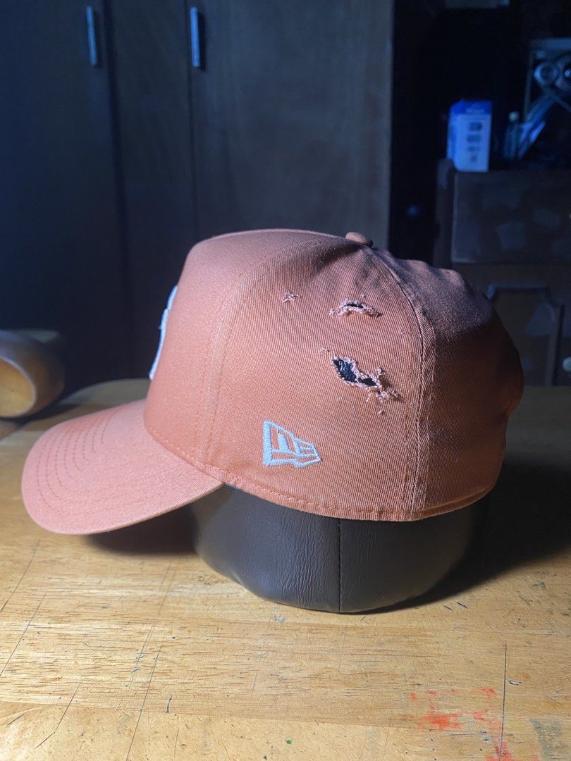 New Era Orange Snapback (Category: Caps & Hats) located in Las Pinas. Submitted by grime2glory_ (Listing ID 1469030875, Image 2). Description: Holes Damaged Snap.