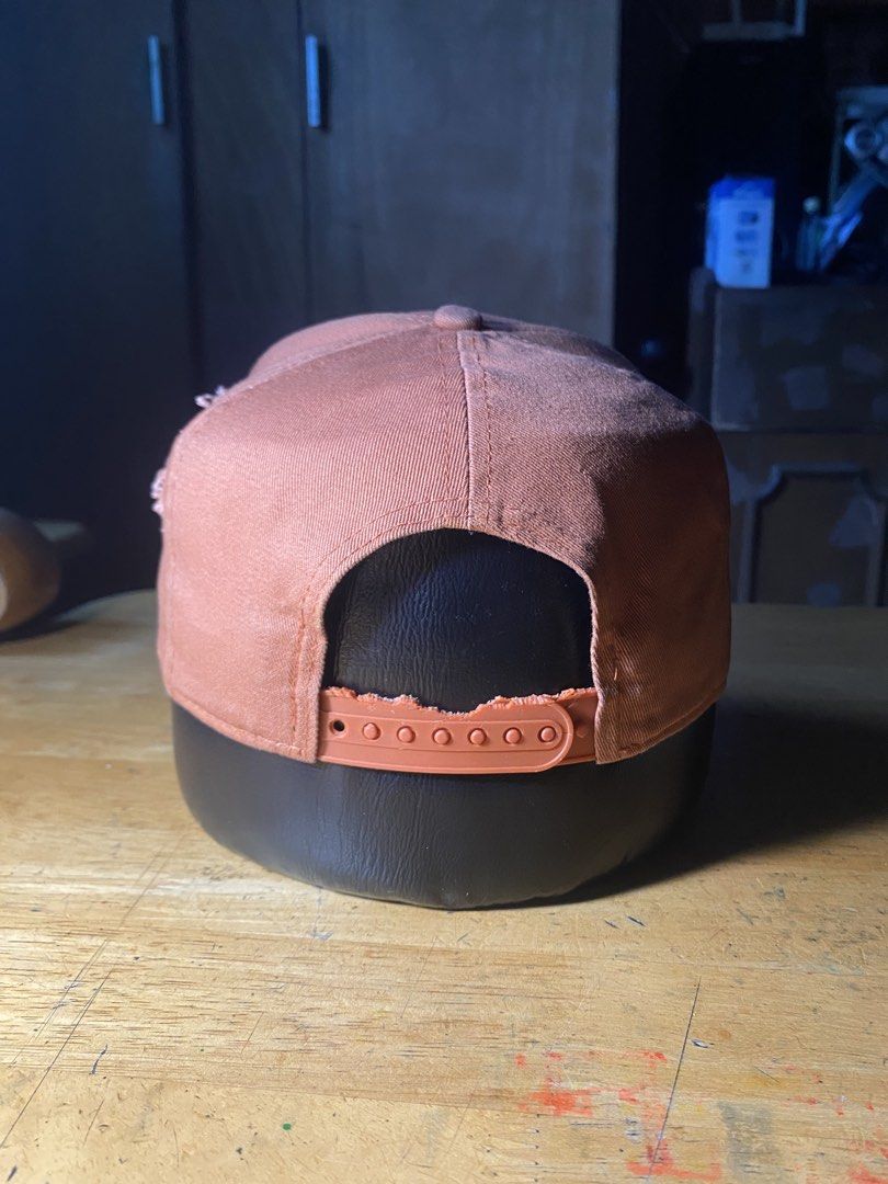 New Era Orange Snapback (Category: Caps & Hats) located in Las Pinas. Submitted by grime2glory_ (Listing ID 1469030875, Image 3). Description: Holes Damaged Snap.