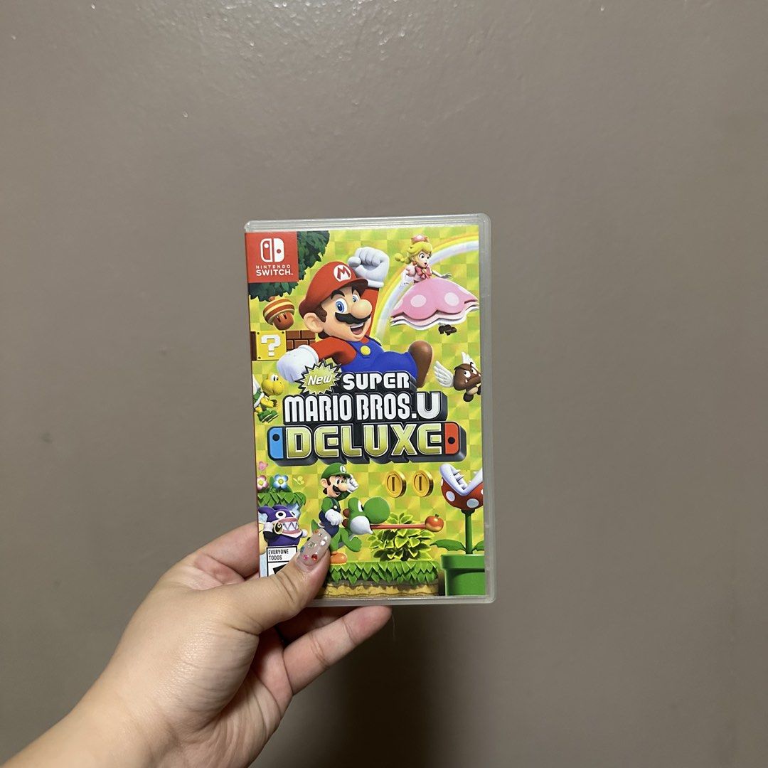 New Super Mario Bros. U Deluxe Nintendo Switch Game (Category: Nintendo) located in Manila. Submitted by jlnclaire (Listing ID 1469156554, Image 1). Description: - Game: Super Mario Bros. U Deluxe for Nintendo Switch - Condition: Physical cartridge in original case, both in great shape - Content: Includes both New Super Mario Bros. U and New Super Luigi U (over 160 courses total) - Multiplayer: Play solo or up to 4 players.