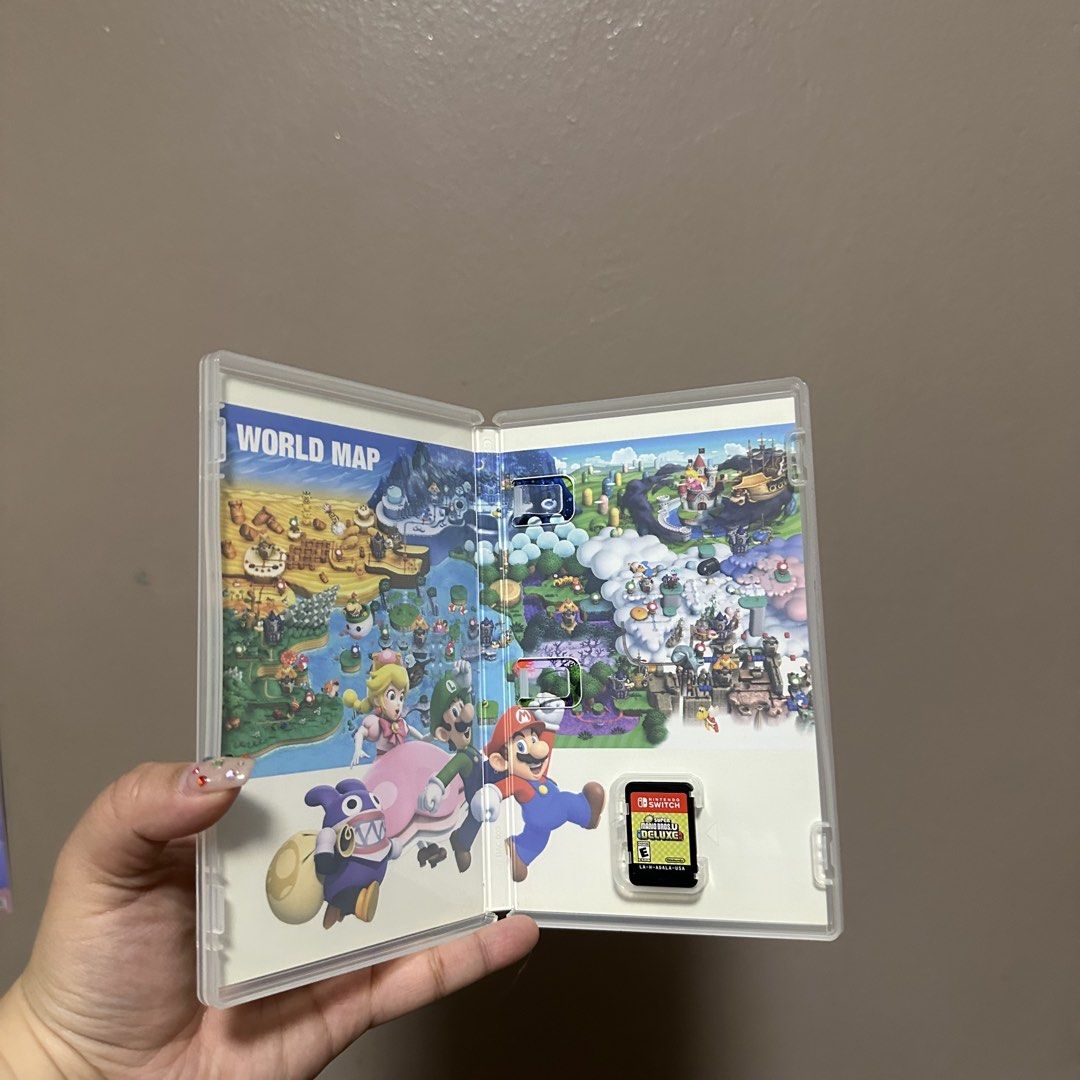 New Super Mario Bros. U Deluxe Nintendo Switch Game (Category: Nintendo) located in Manila. Submitted by jlnclaire (Listing ID 1469156554, Image 2). Description: - Game: Super Mario Bros. U Deluxe for Nintendo Switch - Condition: Physical cartridge in original case, both in great shape - Content: Includes both New Super Mario Bros. U and New Super Luigi U (over 160 courses total) - Multiplayer: Play solo or up to 4 players.