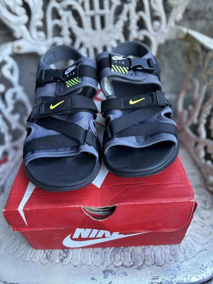 Nike Air Max Sol Sandal (Category: Sneakers) located in Marikina City. Submitted by jamescu87 (Listing ID 1469063244, Image 1). Description: - Brand: Nike - Model: Air Max Sol Sandals - Colorway: Grey, Black, and Volt Yellow - Size: EU 41 8us 26cm - Closure: Adjustable straps with buckle and velcro fastenings - Comfort: Iconic Air unit cushioning in the heel for impact absorption - Condition: Soles show minor dirt from previous wear, structure re