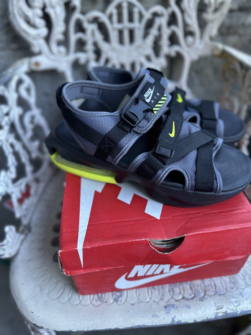 Nike Air Max Sol Sandal (Category: Sneakers) located in Marikina City. Submitted by jamescu87 (Listing ID 1469063244, Image 2). Description: - Brand: Nike - Model: Air Max Sol Sandals - Colorway: Grey, Black, and Volt Yellow - Size: EU 41 8us 26cm - Closure: Adjustable straps with buckle and velcro fastenings - Comfort: Iconic Air unit cushioning in the heel for impact absorption - Condition: Soles show minor dirt from previous wear, structure re
