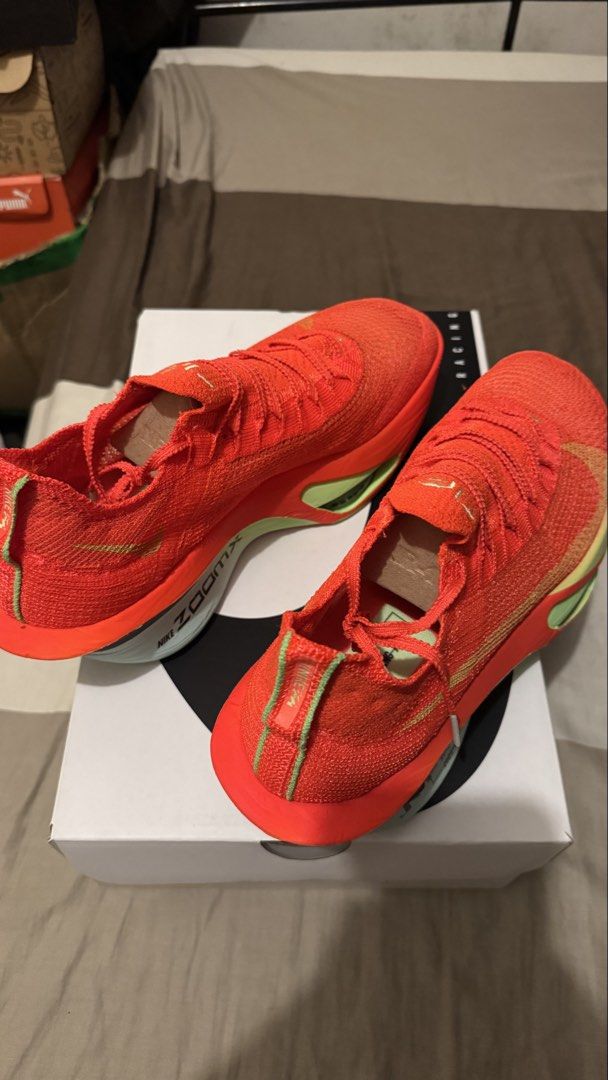 Nike Air Zoom Alphafly Next% 3 Bright Crimson (Category: Sneakers) located in Manila. Submitted by kimlj (Listing ID 1468989680, Image 3). Description: - Model: Nike Air Zoom Alphafly Next% 3 - Colorway: Bright Crimson and Green - Size: Men's US 10 / Women's US 11.5 - Condition: Brand new in original box with paper stuffing intact - Features: High-performance marathon racing shoes with ZoomX foam cushioning and carbon fiber plate.