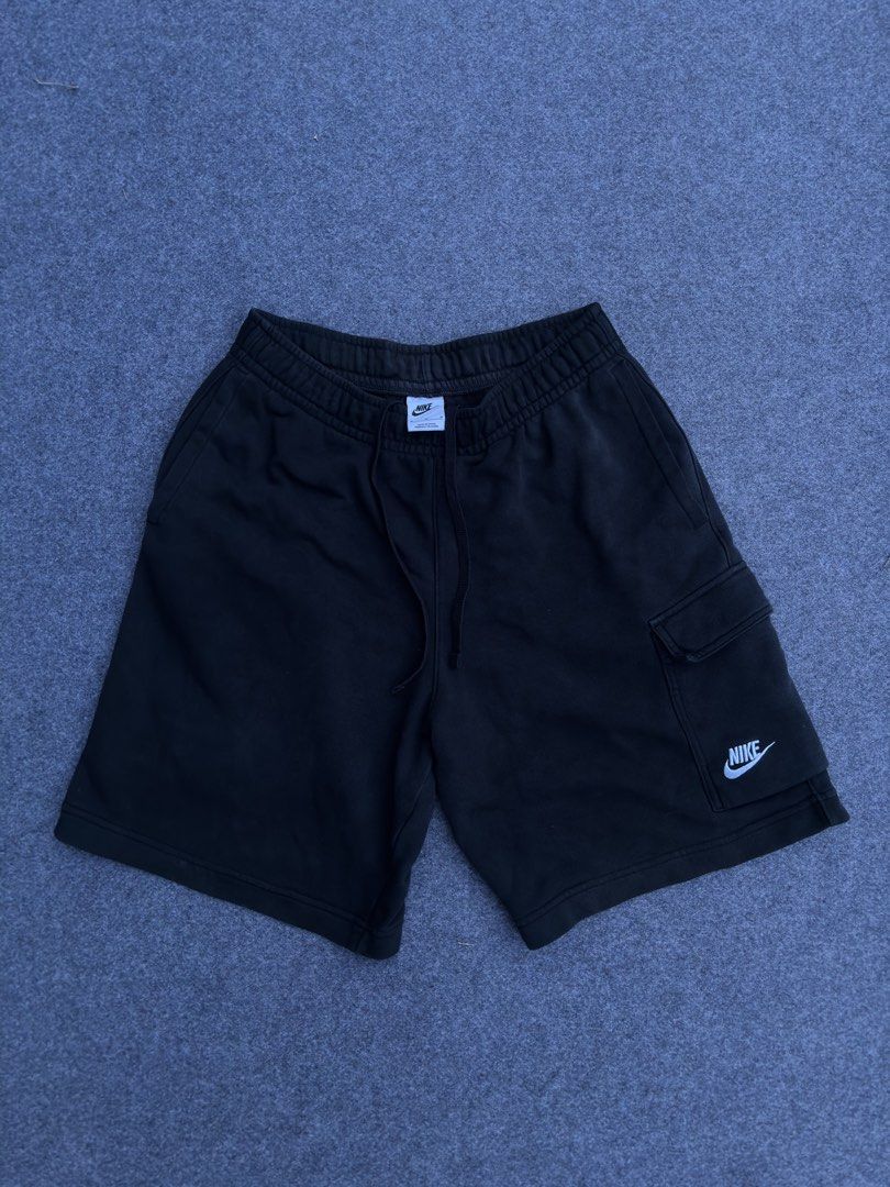 Nike Black Fleece Cargo Shorts (Category: Shorts) located in Lapu Lapu. Submitted by thatdamngrails (Listing ID 1468968397, Image 2). Description: - Authentic black Nike fleece shorts - Soft and cozy material, ideal for casual wear or lounging Size 28-34 stretchable Length 19 Hem 12 Complete Tags (wash tag is darkened) 2 Side Pockets 1 Cargo Pockets with 2 pock Buttons - Adjustable drawstring waistband for a custom fit - Convenient side pockets f