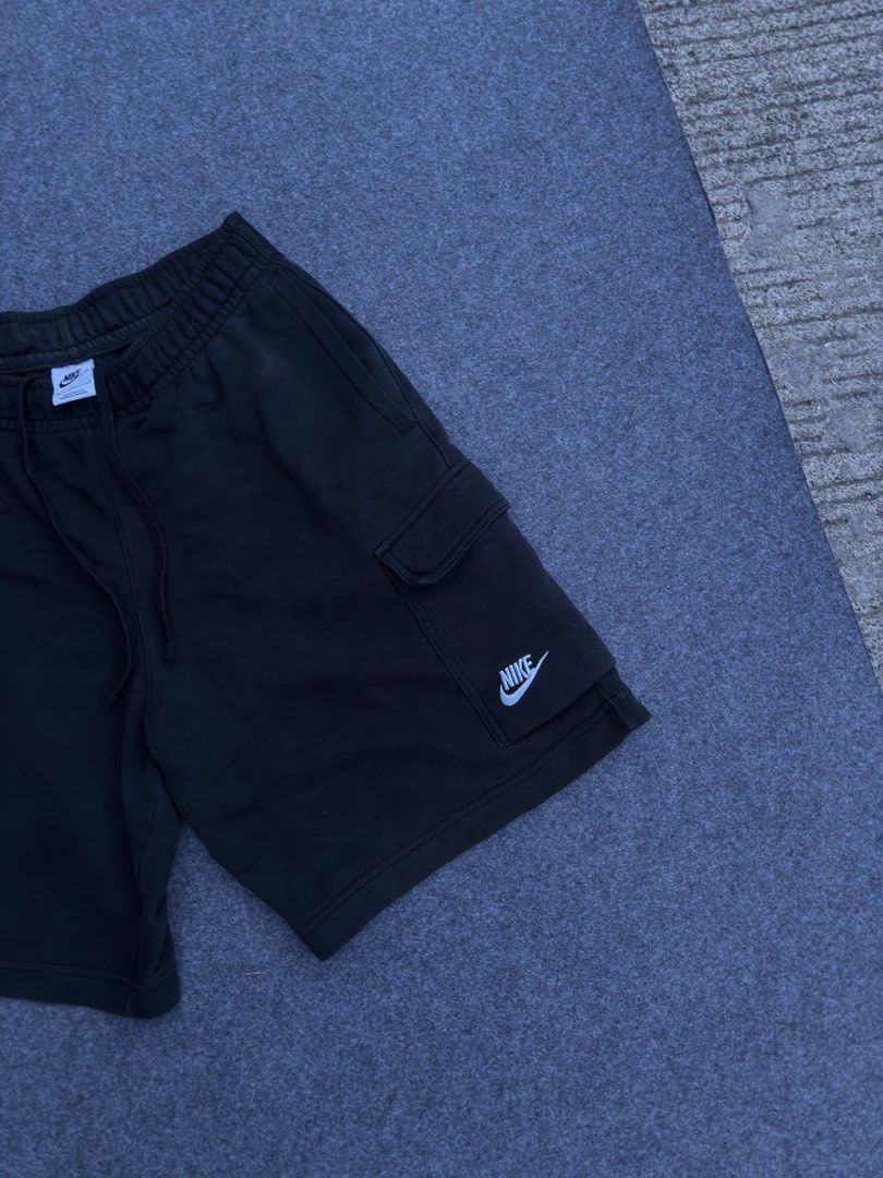 Nike Black Fleece Cargo Shorts (Category: Shorts) located in Lapu Lapu. Submitted by thatdamngrails (Listing ID 1468968397, Image 3). Description: - Authentic black Nike fleece shorts - Soft and cozy material, ideal for casual wear or lounging Size 28-34 stretchable Length 19 Hem 12 Complete Tags (wash tag is darkened) 2 Side Pockets 1 Cargo Pockets with 2 pock Buttons - Adjustable drawstring waistband for a custom fit - Convenient side pockets f