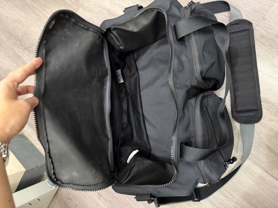 Nike Black Gym Duffel Bag with Multiple Pockets (Category: Backpacks) located in Manila. Submitted by gmfhardware (Listing ID 1468930917, Image 2). Description: - Authentic Black Nike Duffel Bag - Rugged, durable material with heavy-duty zippers - Multiple exterior zipped pockets for easy organization - Large main compartment featuring mesh interior dividers - Comfortable padded shoulder strap and dual carry handles - Ideal for gym sessions, spor